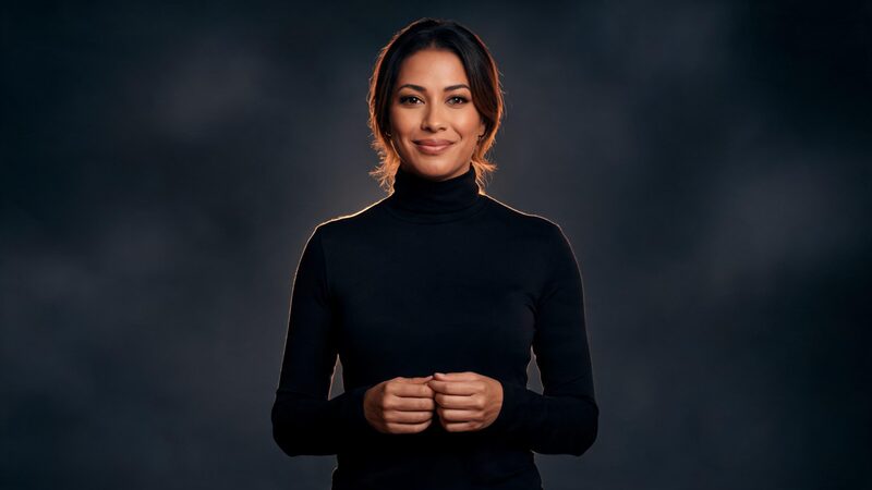 A woman in a black turtleneck